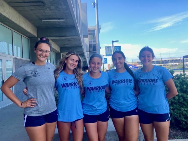 The Warriors pose next to the soccer field after their 3-2 win against Santa Monica. Pictured left to right: Assistant Coach Sophia Ceman, Forward Allison Sibley, Midfielder Tana Wynia, Defender Alexi Anaya, and Defender Jayd Lupoli-Sweet.