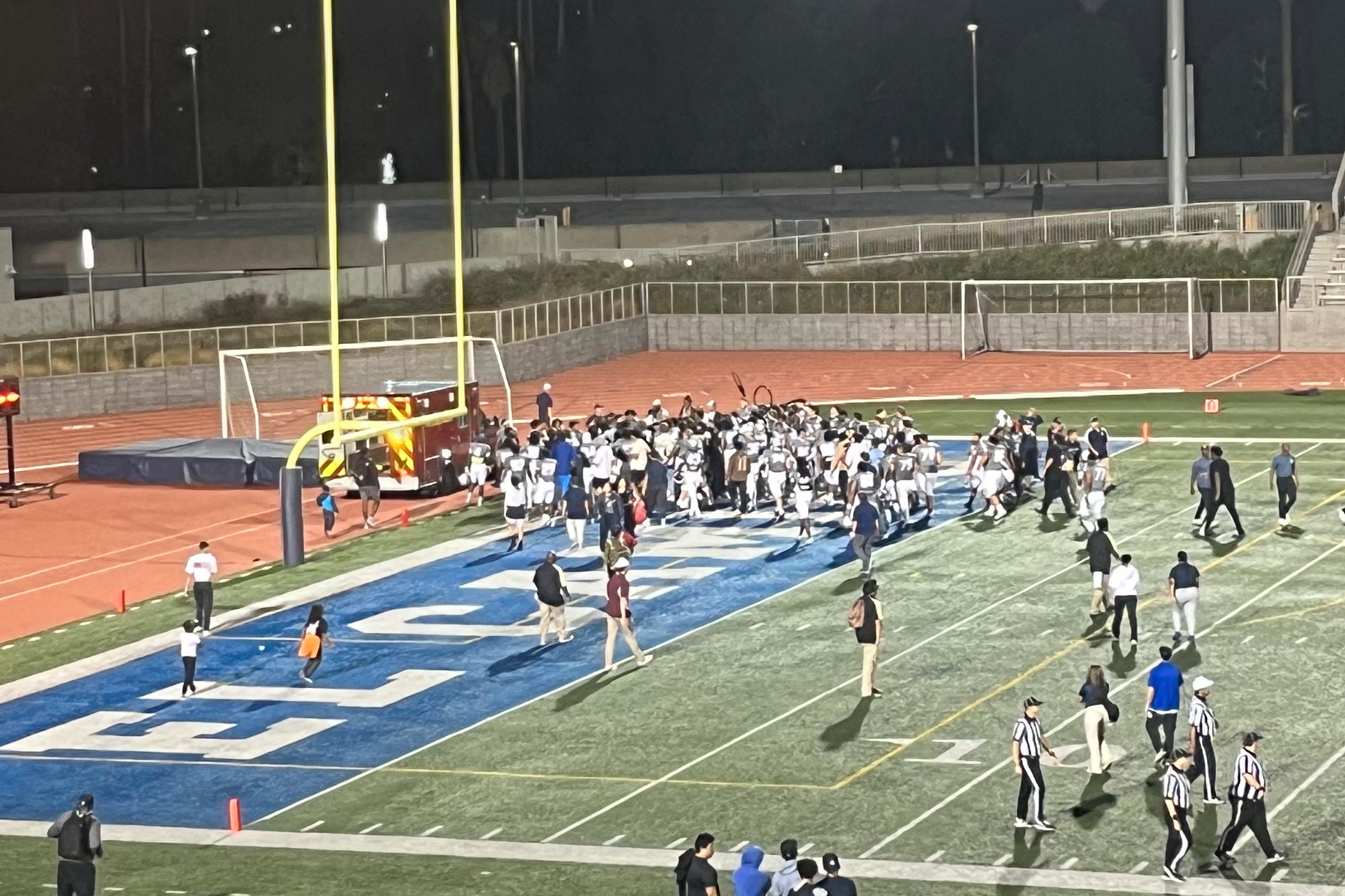 Players and officials crowd around El Camino defense back Travis Roberts after he was injured during a football game against Southwestern College at Featherstone Field on Saturday, Sept. 2, 2023. (Ivan Gonzalez | The Union)