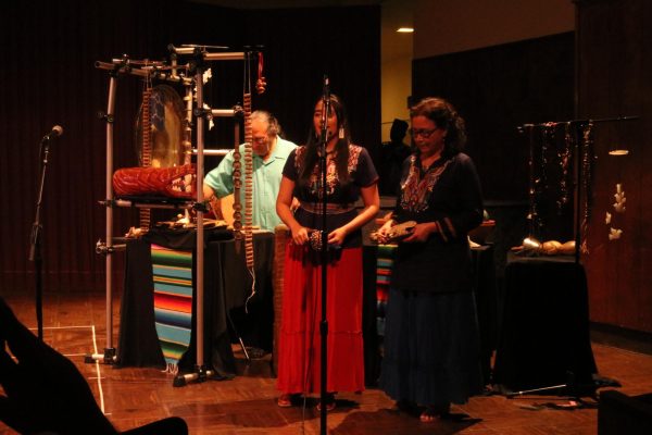 Alegria Garcia (left) and Yolanda Garcia sing in Nahuatl, one of the native languages of Mexico, while Christopher Garcia plays Mesoamerican percussion instruments during the First Annual World of Music Festival at the Haag Recital Hall on Thursday, Oct. 12. (Katie Volk | The Union)