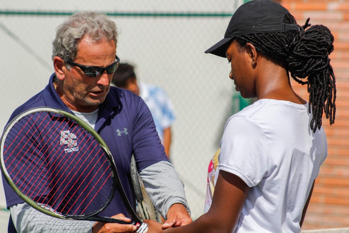 Sergiu Boerica, El Camino College tennis coach, gives instructions to his student, Jada Nesbitt, at the ECC Tennis Courts on Wednesday, Sept. 27. (Monroe Morrow | The Union)