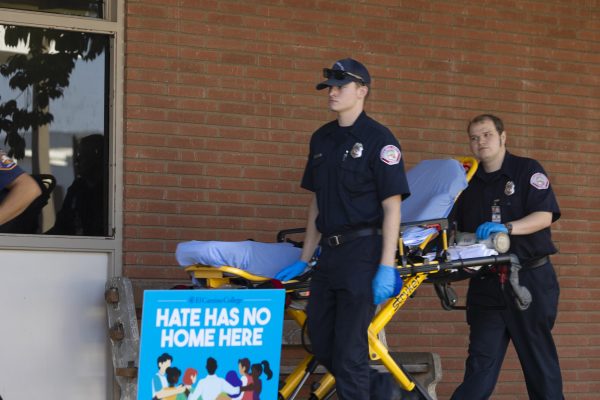 Emergency medical technicians carry a stretcher to transport a student suffering from breathing complications during an event at the Social Justice Center on Oct. 18. A 911 call was made approximately at 1:27 p.m. when the student began hyperventilating at the event. (Khoury Williams | The Union)