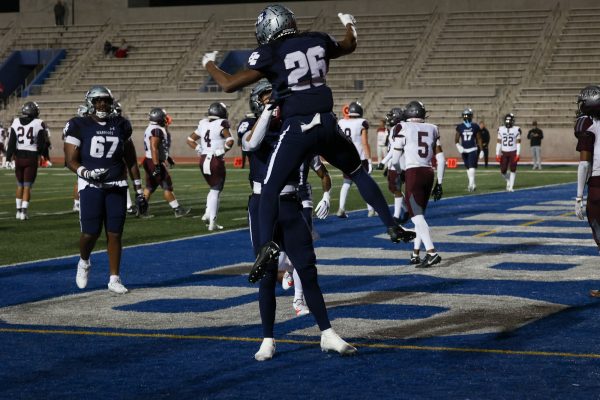 An El Camino player jumps up in celebration after scoring at a home game on Saturday, Oct. 28. El Camino's eighth football game at Murdock Stadium Field saw the Warriors defeat the Antelope Valley 60–7. (Bryan Sanchez | The Union)