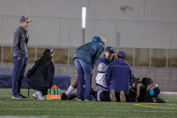 Staff members check on an El Camino player who was hurt during a home game at El Camino College on Saturday, Oct. 28. (Bryan Sanchez | The Union)