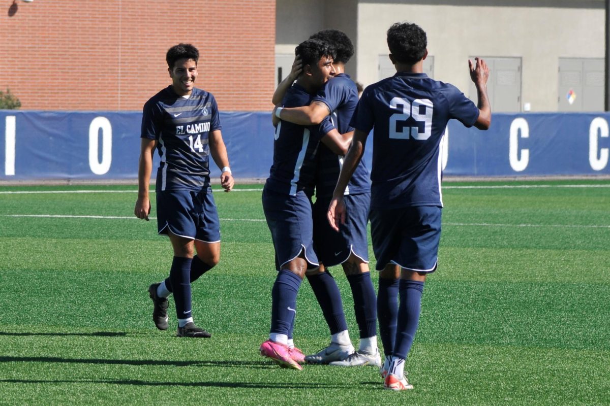 In an Oct. 20, 2023 match against Los Angeles Harbor College, members of the El Camino men’s soccer team celebrate after scoring the first goal. The Warriors would go on to win with a final score of 6-3. (Ira Mendoza | The Union)