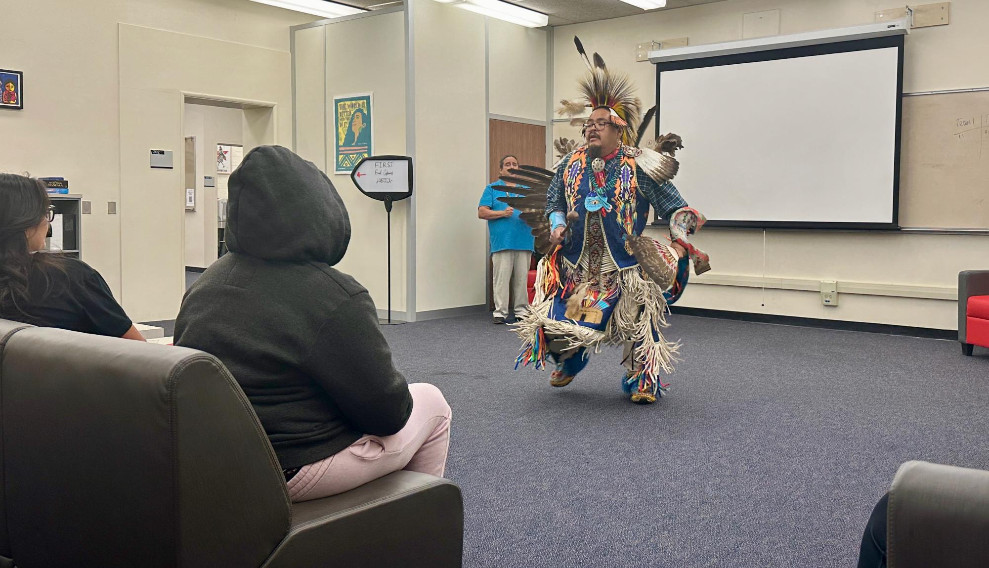 Tso Yanez dances during a drum circle at the Social Justice Center on Wednesday, Nov 15. (Nick Geltz | The Union)