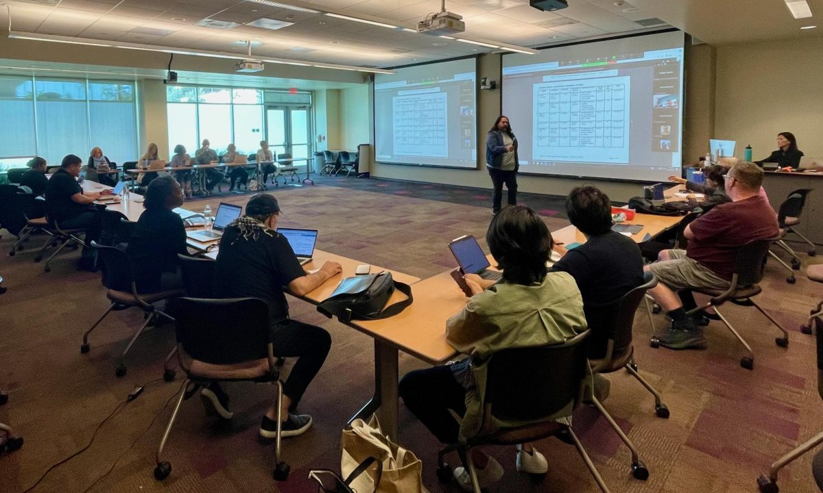 Members of the College Council discussing agenda items during the College Council meeting in the Distance Education Library on Monday, Nov. 20. A proposal to change the 2024-2025 academic calendar was discussed and is pending further review. (Joshua Flores | The Union)