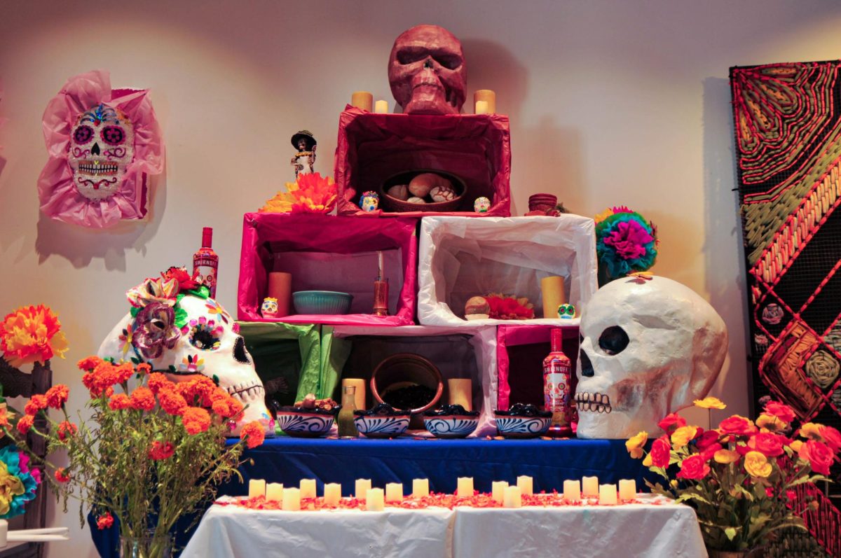 Volunteers, workers and art students honor those who have passed by setting up an altar and creating a Dia De Los Muertos exhibit at the Arts Complex on Nov. 1. ( Isabelle Ibarra | The Union)