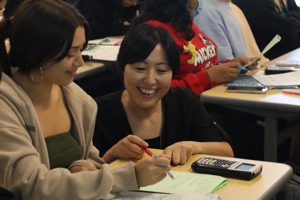 Junko Forbes, right, assists a student during a statistics class in an El Camino College classroom on Thursday, Sept. 21. Forbes is now in her 15th year teaching mathematics at the college.
