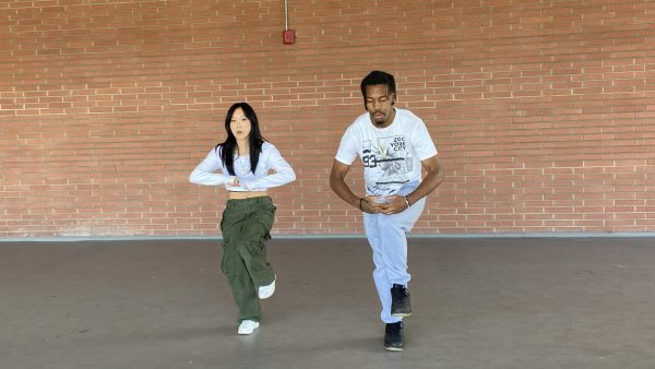 Rayshawn Reed dances hip-hop with Katie Ko on the floor above the El Camino College Bookstore on Thursday, Nov. 9. (Angela Osorio | The Union)