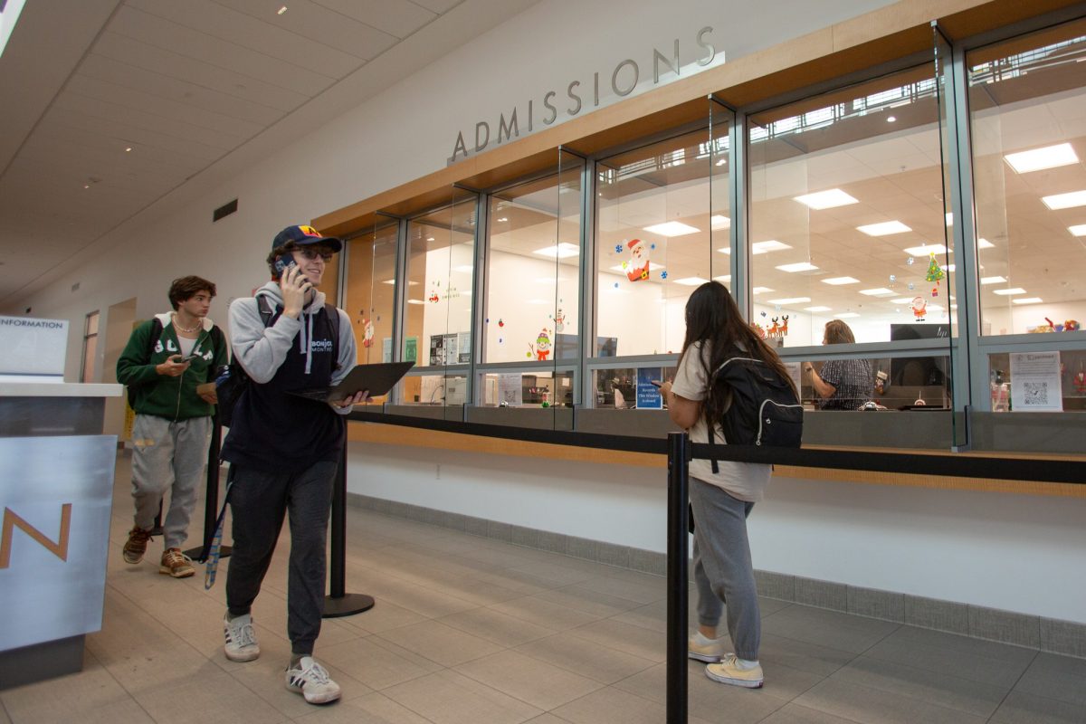 Students walk by the Admissions office in the Student Services Building on Tuesday, Dec. 5. (Raphael Richardson | The Union)