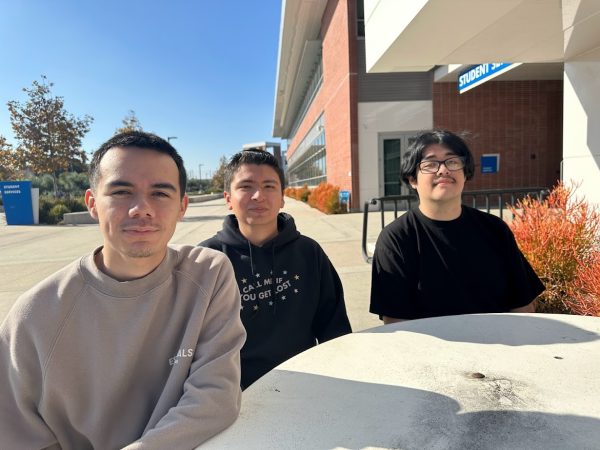 El Camino College Rocket League esports team members Diego Cisneros, left, Pedro Carrillo, center, and Pedro De Nava sit outside the Student Services Building on Thursday, Dec. 7. The team went undefeated this season after defeating Purdue University in its final match. (Eddy Cermeno | The Union)