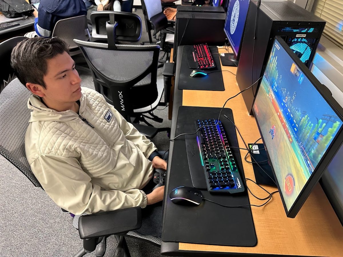 El Camino College Rocket League esports team captain Pedro Carrillo plays on online match of Rocket League in the Warrior Esports Center on Monday, Dec. 11. Carrillo has been playing Rocket League since the game released in 2016. (Eddy Cermeno | The Union)