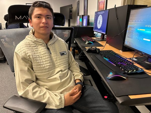 El Camino College Rocket League esports team captain Pedro Carrillo poses for a photo after playing Rocket League in the Warrior Esports Center on Monday, Dec. 11. Carrillo was previously a part of Leuzinger High School's esports club before attending El Camino. (Eddy Cermeno | The Union)