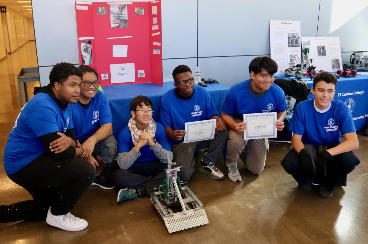 Members+of+the+North+Torrance+High+Junior+Reserve+Officer+Training+Corps+program+pose+with+their+robot+entry+for+the+Robotics+Exhibition+Power+Bot+after+winning+best+poster+presentation+at+the+event+on+Wednesday%2C+Dec.+6.+%28Joseph+Ramirez+%7C+The+Union%29