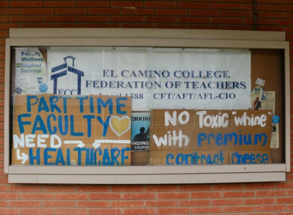 The front window display of the El Camino College California Federation of Teachers faculty union office on Sept. 2. The display is decorated with signs used during Federation demonstrations. (Delfino Camacho) | The Union)