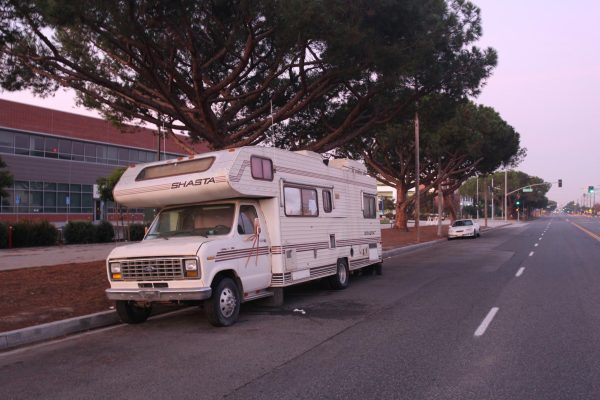 A motor home and a car are the only vehicles parked on Manhattan Beach Boulevard, next to the El Camino College Student Services Building, early Sunday morning, Dec. 3.