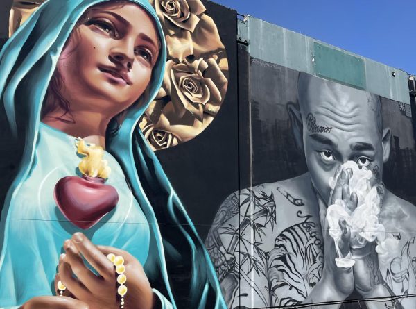 Graffiti murals cover the outside walls of the Del Amo Swap Meet in Rancho Dominguez including a tribute to Tupac Shakur, pictured here on Oct. 29, 2023. The idea that “rap” alone could define such a diverse culture was quickly abandoned, and Hip Hop came to be seen as encompassing four elements: MCing (also known as rhyming or rapping), DJing, breaking and graffiti. Later, people added fashion and a whole new flavor of social justice organizing into the mix. Kim McGill | Warrior Life