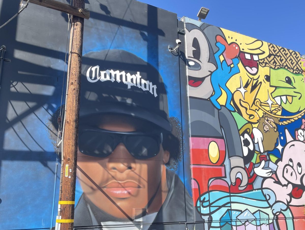 Large+murals+decorate+the+outside+walls+of+the%0ADel+Amo+Swap+Meet+in+Rancho+Dominguez%2C+pictured+here+on+Oct.+29%2C+2023%2C+including+a+tribute+to+Compton+rapper+and+co-founder+of+both+Ruthless+Records+and+N.W.A.%2C+Eazy-E+%28Eric+Wright%29.+Swap+meets+sold+Hip+Hop+mix+tapes+and+records+long+before+commercial+radio+and+music+producers+recognized+L.A.+artists.+Eazy-E+forged+a+special+relationship+with+North+Korean+immigrant+Wan+Joo+Kim+who+opened+Cycadelic+Records+at+Compton+Swap+Meet.+Eazy-E+delivered+boxes+of+Ruthless+Records%E2%80%99+first+single+%E2%80%9CBoyz-in-the-Hood%E2%80%9D+out+of+the+trunk+of+his+car+to+Kim+and+other+swap+meet+vendors+throughout+South+L.A.+Kim+McGill+%7C+Warrior+Life