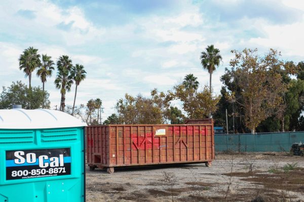 A roll-off dump container sits inside the project site for the Modular Village on Nov. 29. (Nathaniel Thompson | The Union)