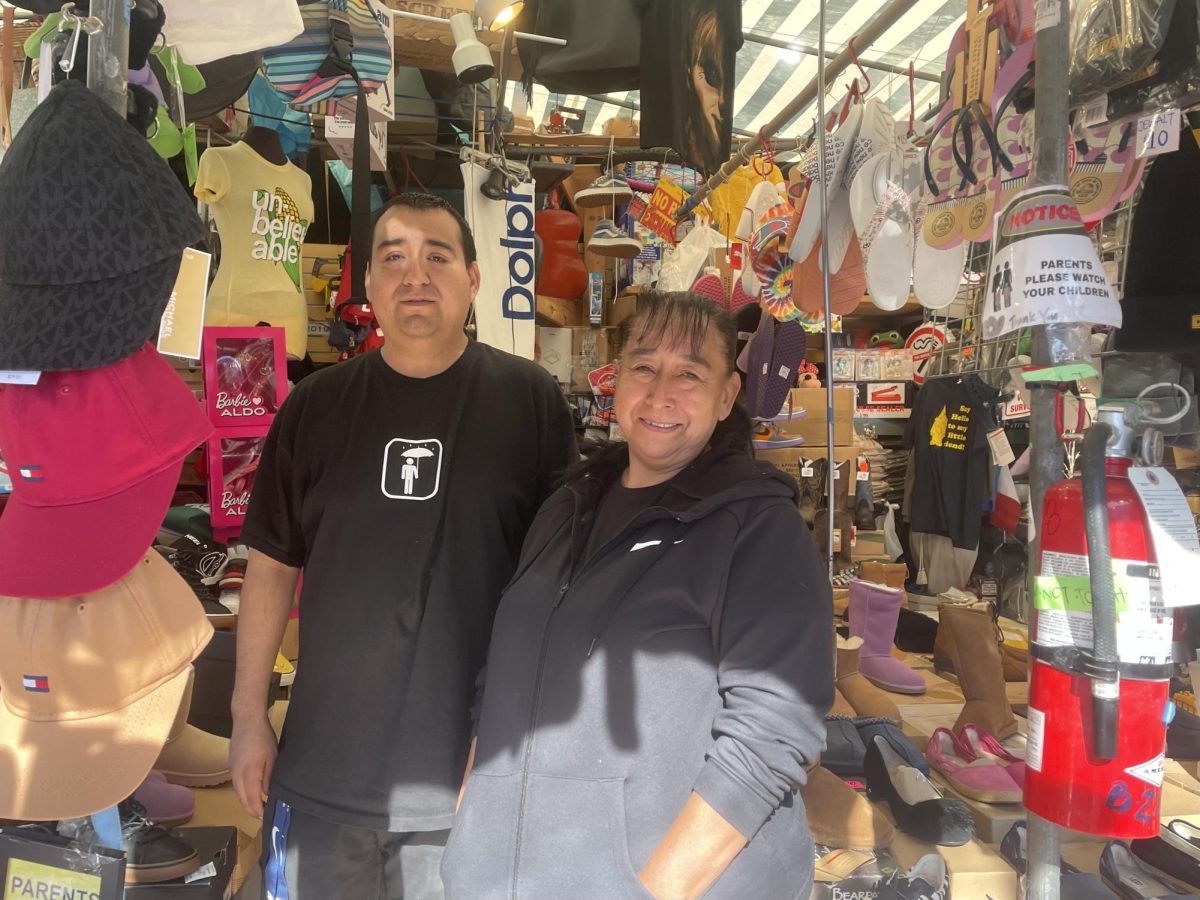 Dolores+Arzola+%28right%29+and+her+son%2C+Jose+Guerrero%2C+who+helps+her+work+the+stand+and+sell+merchandise.+Arzola+has+been+a+vendor+for+20+years+and+says+that+she+enjoys+selling+to+people.+%28Emily+Gomez+%7C+The+Union%29