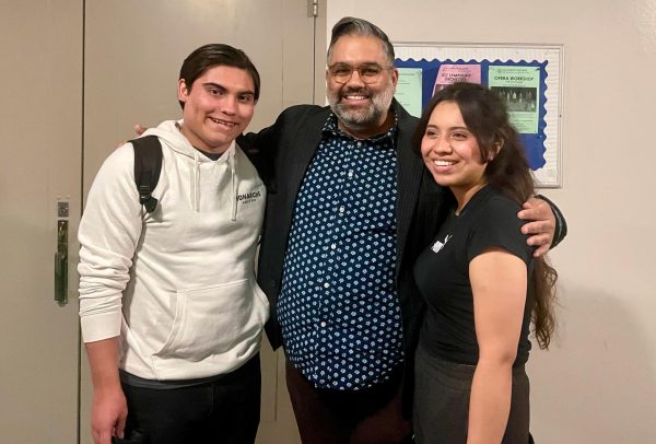 The Miracle Worker director Nathan Singh, center, poses with actors from the play on Friday, Dec. 1. Andres Diaz, left, plays Perry and Xiomara Penado plays Helen Keller. (Emily Gomez | The Union)