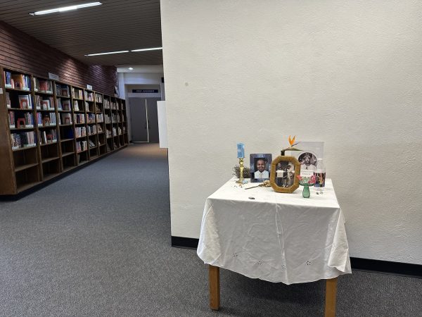 The makeshift altar to commemorate the dead is in the Schauerman Library lobby. Hana Oshita, a library worker who set it up, said she has not decided until when the memorial will remain there but her coworkers are still adding pieces on the altar to remember the dead. (Ma. Gisela Ordenes | The Union)