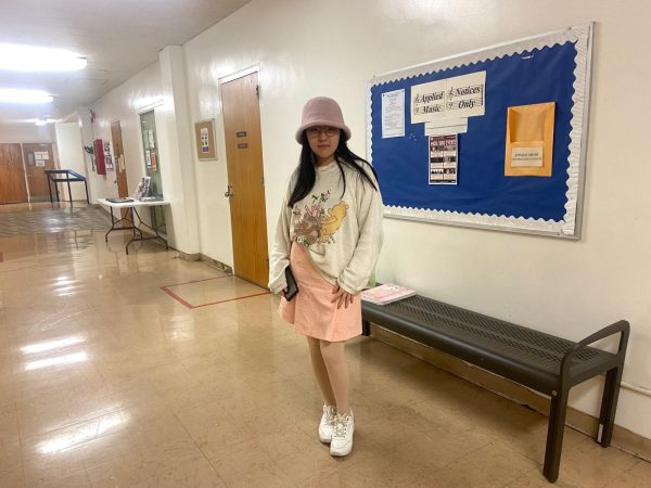 Angelina Hu, 18 year-old music major, poses with her pink outfit in celebration of Valentine's Day. Although she doesn't have a valentine this year, she said she enjoys dressing up for the holiday.