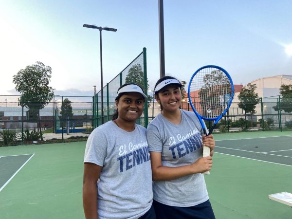 El Camino sophomore and computer science major Pranathi Chamarthi, 19, poses next to sophomore and psychology major Kamila Bustos, 19,  at the ECC Tennis Courts on Tuesday, Feb. 27, following the end of their single matches, which they lost to Mt. San Antonio College. Chamarthi joined the team last summer and Bustos joined last spring, although the season was canceled that year due to a lack of players. “I’m actually very proud of everyone on the team…knowing my team and knowing how they do in practice, I know that they put their all in,” Chamarthi said. (Angela Osorio | The Union)
