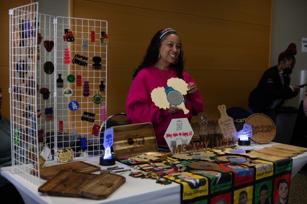 Leanna Cooper, owner of Colors Make Me Happy LLC, showcases one of her products–an affirmation mirror– at her booth during the Mini Black Market Flea in the East Dining Room on Wednesday, Feb. 21. (Ethan Cohen | The Union)