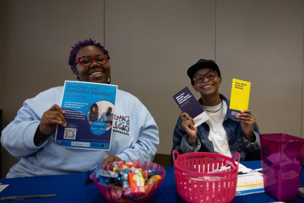 Community Health Worker Vanessa Barnes (left), and Health Promoter Sunni Johnson, 24, at the Planned Parenthood booth during the Taste of Soul and Mini Black Market Flea events in the East Dining Room on Wednesday, Feb 21. (Ethan Cohen | The Union)
