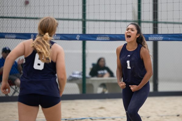 Crystal Salgado, right, celebrates with teammate Alyssa Estrada after a long-fought set against the Mt. SAC No. 5 duos Eva Becerra and Freda Lei at the ECC Sand Courts on Friday, March 22. (Ethan Cohen | The Union)