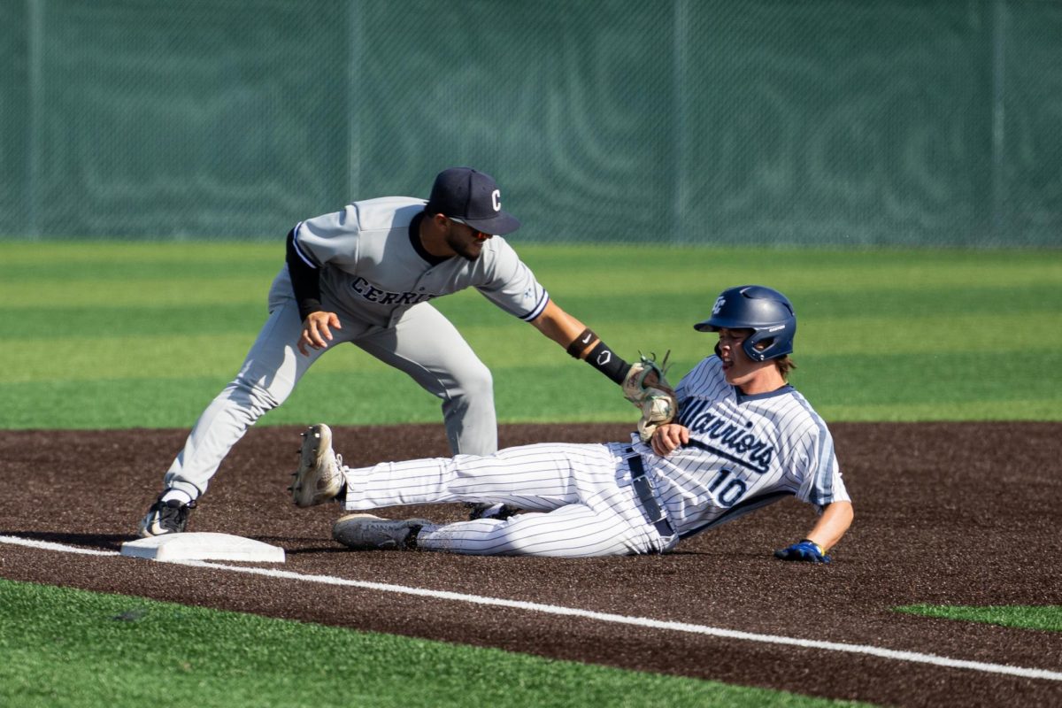 Cerrito's third baseman Anthony Bassett tags out El Camino shortstop Lucas Bonham as he advances to third base at Warrior Field on Thursday, March 7. The Cerritos College Falcons beat the El Camino College Warriors 8-5 in an extra-innings rally which stopped the Warriors short of a late-game comeback. (Ethan Cohen | The Union)