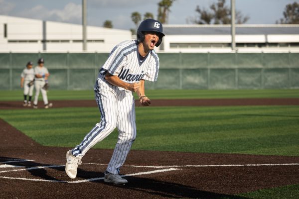 El Camino Warriors pinch-runner Ian Wilson celebrates as he scores a late 9th-inning run to tie the game 4-4 against Cerritos. The March 7 game went into extra innings leading to a Cerritos rally to beat the Warriors 8-5. (Ethan Cohen | The Union)