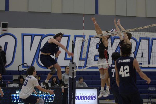 El Camino College outside hitter No. 18 Garrett Gronbach spikes the ball over the net in hopes of scoring a point for the Warriors in the second set of the Mens Volleyball game against Santa Barbara City College at the ECC Gym Complex  on Friday, March 8. (Renzo Arnazzi| The Union)