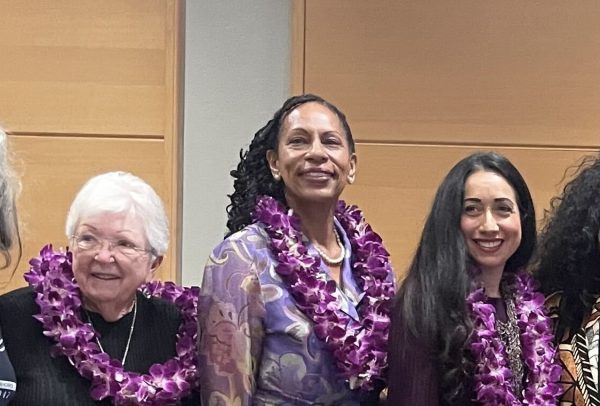 Candy Paula, center, local singer, artist and musician, poses next to other Distinguished Women Award recipients after the March 27 reception honoring the awardees. (Erica Lee | The Union)
