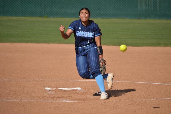 El Camino College softball pitcher Emma Figueroa follows through with her pitch during the Warriors' game against the Chaffey College Panthers at the ECC Softball Field on Wednesday, March 20. (Caleb Smith | The Union)