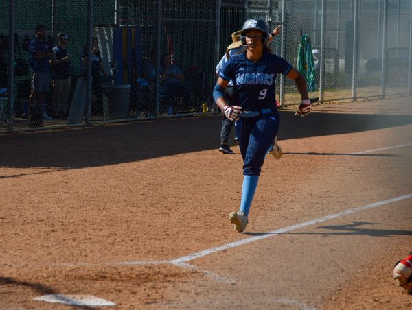 El Camino College infielder Cheyenne Navarro runs home to score and make the game 3-0 in the Warriors' 9-1 win over the Panthers at the ECC Softball Field on Wednesday, March 20 . (Caleb Smith | The Union)
