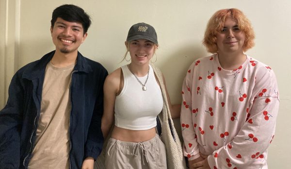 From left, audience members Eric Lazaro, 22 theater major; Peyton Garber, 20 theater major; and Kelly La Brecque, 20, psychology major, wait to congratulate their cast and crew member friends following the Sunday, March 10 matinee performance of "Merrily We Roll Along" in the Campus Theatre.