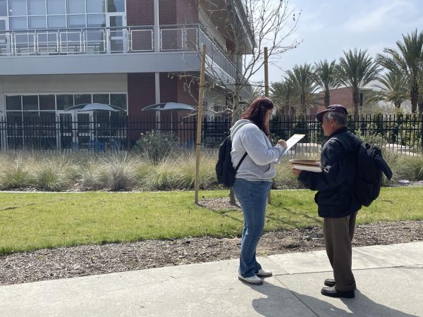 Navigation to Story: Signature gatherers continue to ask for students’ information
