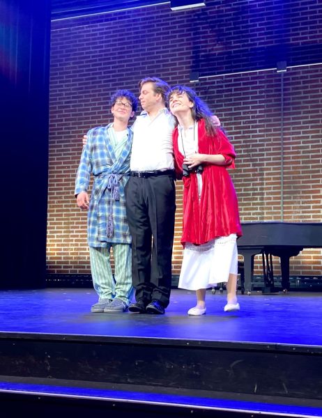 From left, Charley, played by Wyatt Calderon; Frank, played by Ryan Kann; and Mary, played by Kayla Steffanson hug one another following their curtain call in the Sunday, March 10 matinee show at the Campus Theatre. (Olivia Sullivent | The Union)
