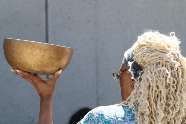 Pastor Sharon Sanders, "The Storyteller," begins the Native American Drum Circle by introducing the "singing bowl" near the El Camino College Art Gallery on Tuesday, March 19. (Jamila Zaki | The Union)