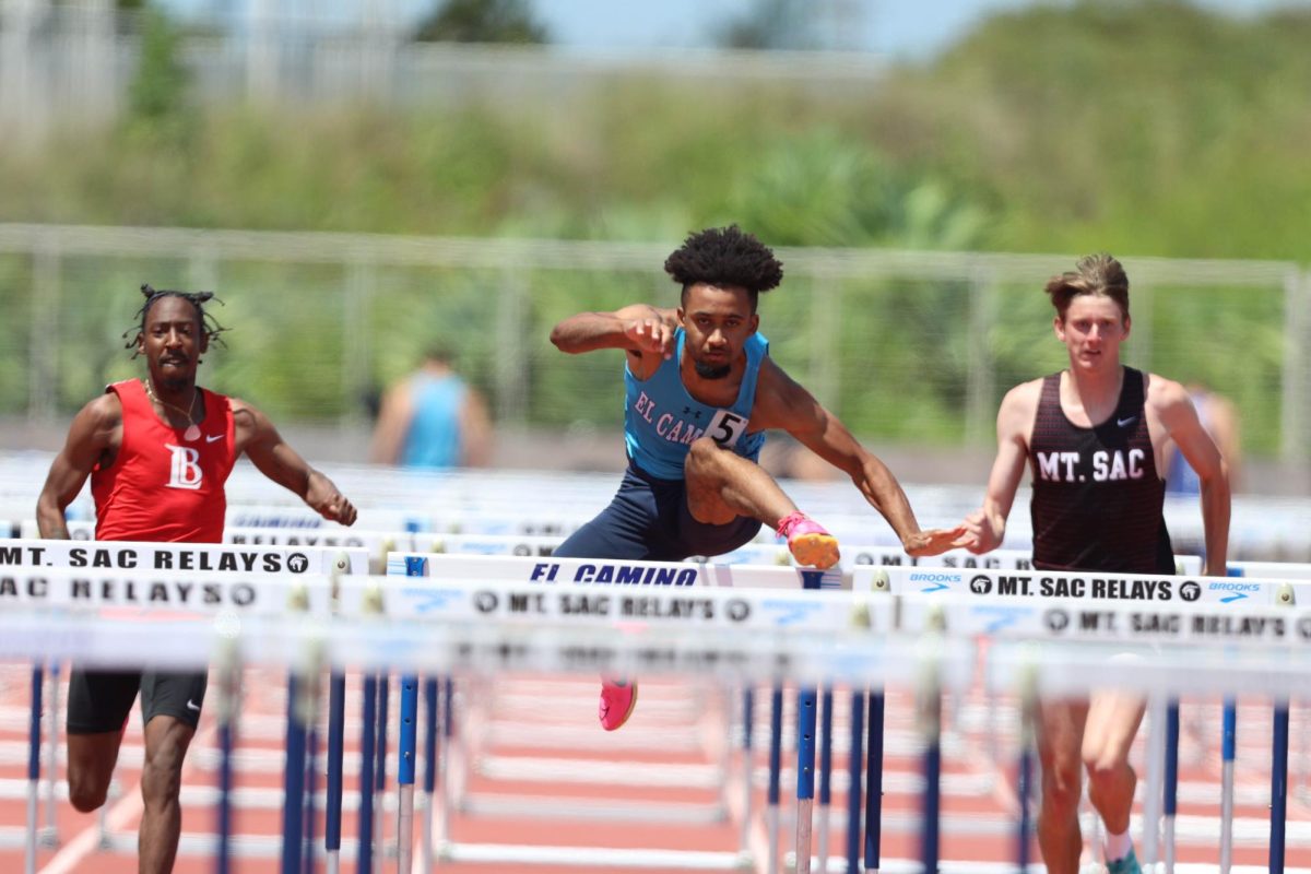 Anthony+Taylor%2C+center%2C+gets+over+a+hurdle+during+the+mens+110-meter+hurdles+during+the+South+Coast+Conference+Prelims+at+Murdock+Stadium+on+Tuesday%2C+April+23.+Taylor+won+his+heat+out+of+lane+five+in+14.35+seconds%2C+the+top+qualifying+time+heading+into+SCC+Finals%2C+which+will+take+place+on+Saturday%2C+April+27+at+Murdock+Stadium.+%28Greg+Fontanilla+%7C+The+Union%29