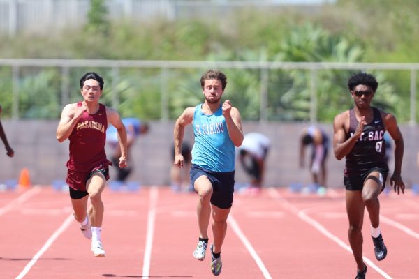 Izak Giacchetto, center, sprints down the track during the men's 100-meter dash at South Coast Conference Prelims on Tuesday, April 23 at Murdock Stadium. Giacchetto clocked in at 11.24 seconds in heat one, out of lane six. (Greg Fontanilla | The Union)