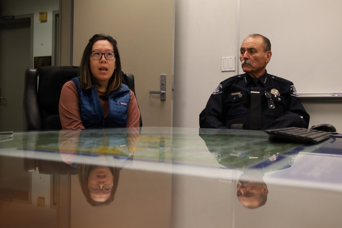 Clery Act Compliance Coordinator Nina Wong, left, and El Camino Police Chief Michael Trevis talk about reporting crime data on colleges to improve campus safety during a media interview at the Campus Police Station on October 31, 2023. The El Camino crime log recorded three incidents of stalking on campus so far in 2024. (Ma. Gisela Ordenes | The Union)