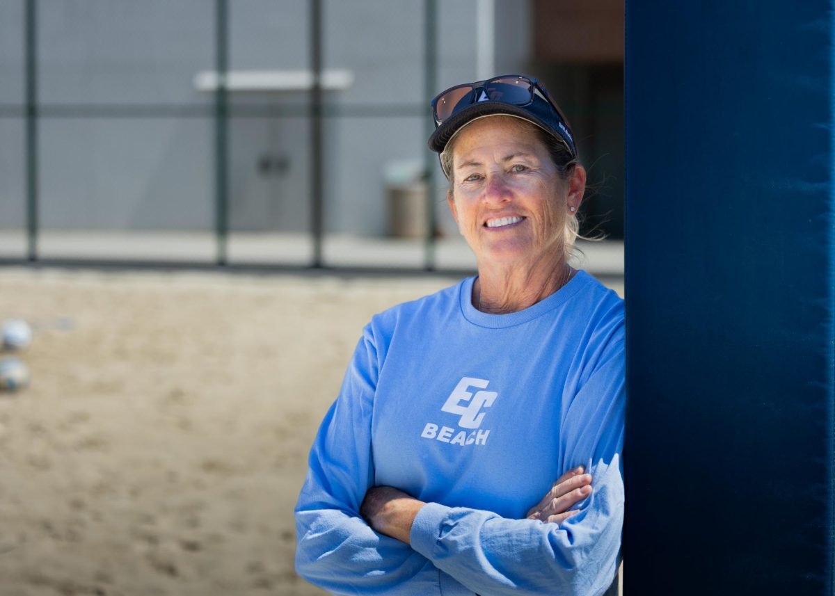 Womens beach volleyball and former womens volleyball coach LeValley Pattison poses for a photo on the ECC Sand Courts. Pattison was inducted into the 3C2A Hall of Fame last month along with five other inductees. Pattison coached the womens volleyball team for 26 seasons and founded the beach volleyball program in 2016. She is a part of the 400-win club. (Ethan Cohen | The Union)