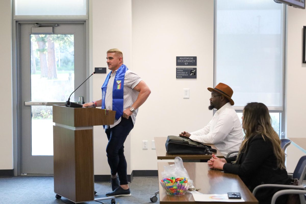 LGBTQIA+ Student Success Coordinator Kenny Simkins presents events that will celebrate El Camino College’s Pride Week starting on May 20 during the Board of Trustees meeting on Monday, April 15. (Nick Miller | The Union)