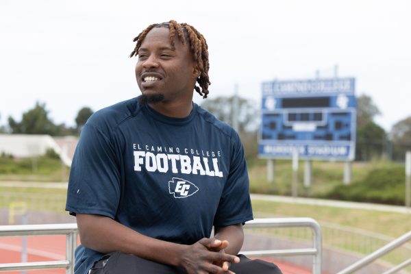 El Camino football player Chance Williams looks off to the distance at Murdock Stadium on April 25, 2024. With the help of El Camino Basic Needs Center Coordinator Sharonda Barksdale, Williams joined El Camino in the middle of the COVID pandemic, and sees Barksdale as a parental figure. (Raphael Richardson | Special to Warrior Life)