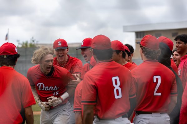 The Santa Ana Dons celebrate Connor Dietschs second-inning two-run home run against the Warriors during Game 2 of the 3C2A SoCal Regionals on Saturday, May 4, at Don Sneddon Field. Dietsch went 2-for-3, with two RBIs and a walk. The Dons beat the Warriors 17-7 ending El Caminos season. (Ethan Cohen | The Union)