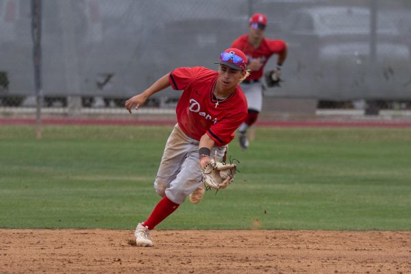 Santa Ana Dons shortstop Christian Altamirano scoops up the ball for a throw to first base against the Warriors in Game 2 of the 3C2A SoCal Regionals at Don Sneddon Field on Saturday, May 4. Altamirano went 3-for-5 against El Camino batting in five RBIs. (Ethan Cohen | The Union)