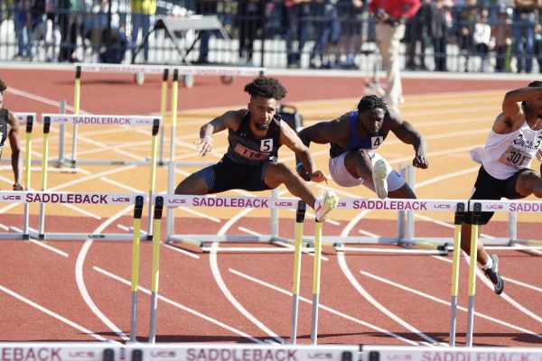 Sophomore Anthony Taylor clears a hurdle during the California Community College Athletic Association's track and field state championship held on Saturday, May 18 at Saddleback College. Taylor clinched a state title and a personal best of 14.12 seconds in the men's 110-meter hurdles out of lane five. (Greg Fontanilla | The Union)